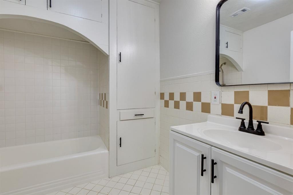 617 Wilson Street Lancaster, TX 75146 - Photo 23 of 30 a bathroom with a sink and a mirror