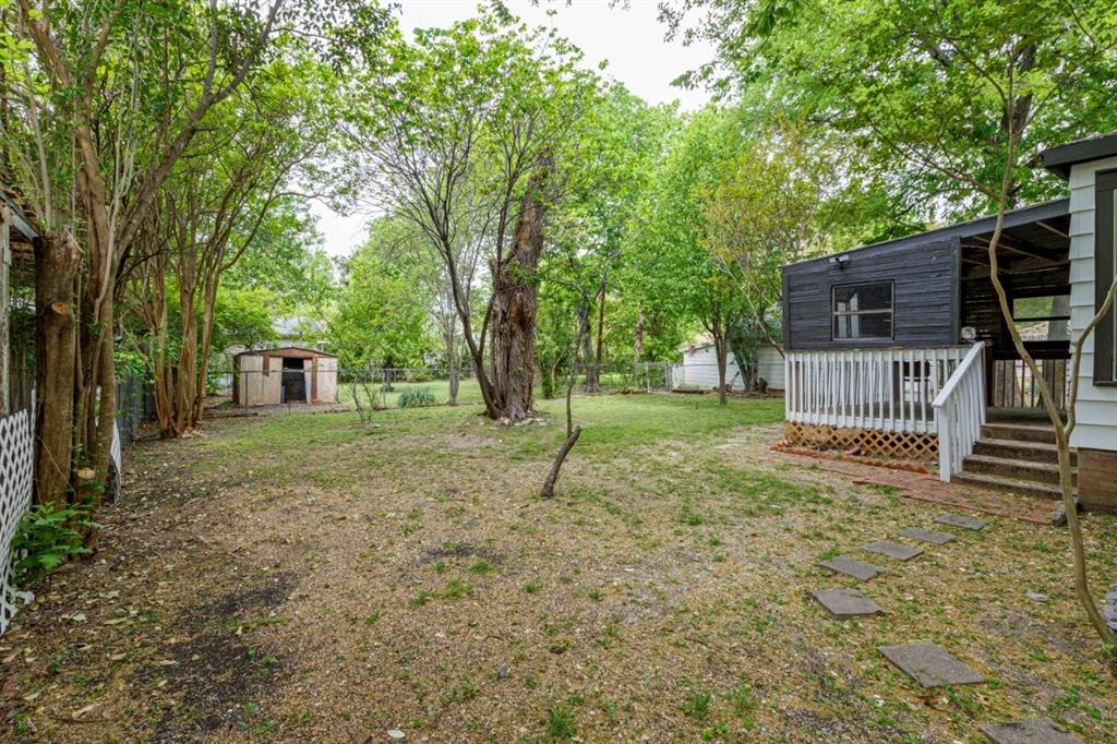 617 Wilson Street Lancaster, TX 75146 - Photo 26 of 30 a house view with a backyard space