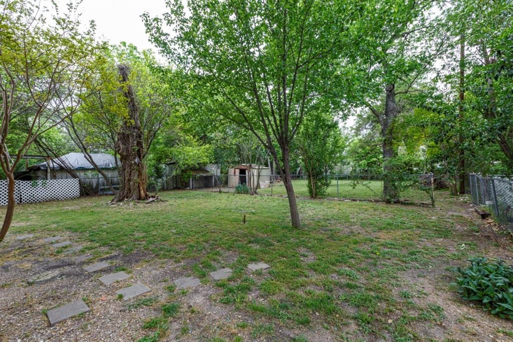 617 Wilson Street Lancaster, TX 75146 - Photo 27 of 30 a view of a yard with a tree
