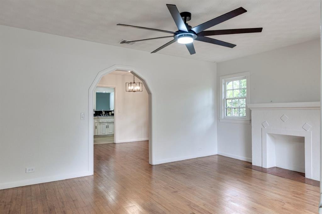 617 Wilson Street Lancaster, TX 75146 - Photo 4 of 30 wooden floor in an empty room with a window