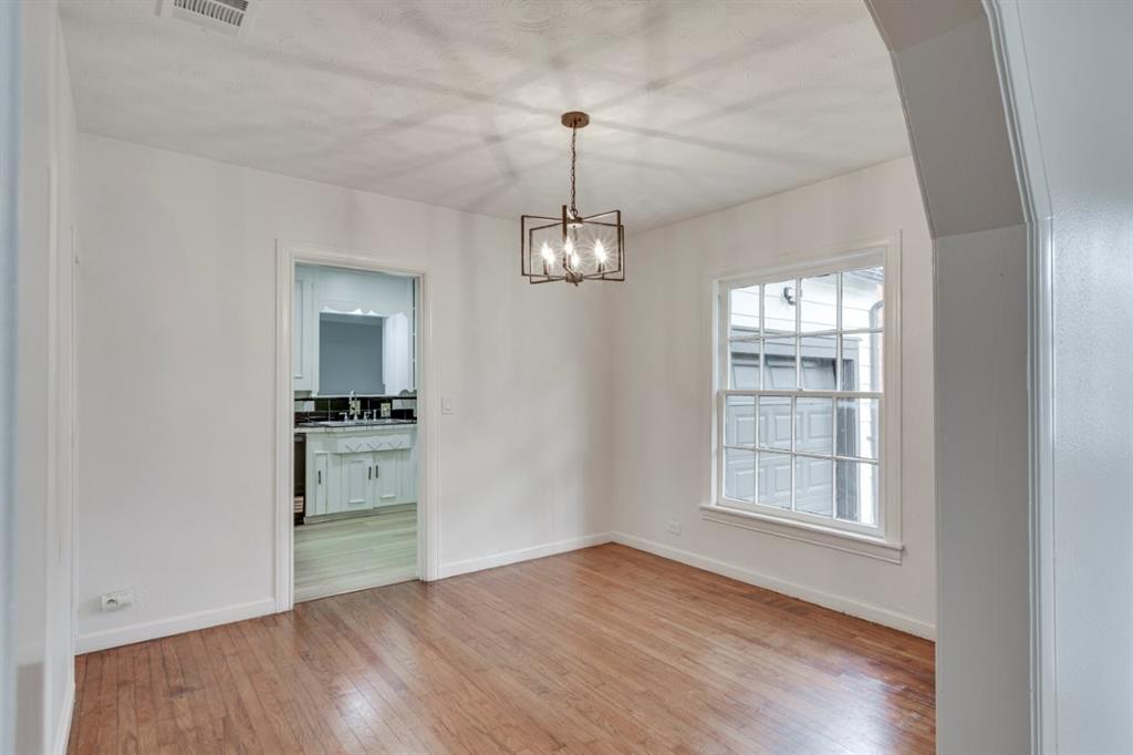 617 Wilson Street Lancaster, TX 75146 - Photo 9 of 30 wooden floor in an empty room with a window