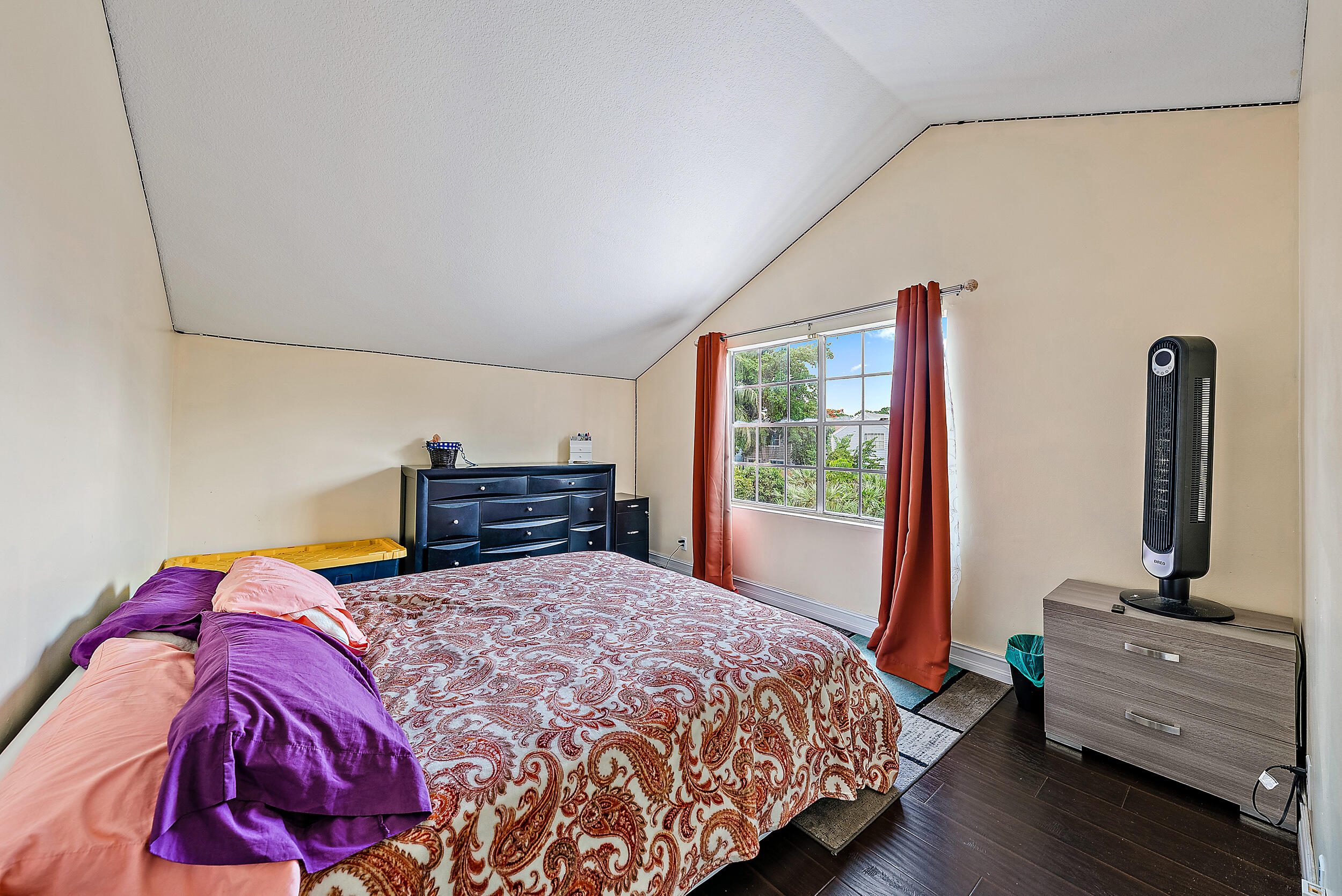 5872 Rambler Rose Way West Palm Beach, FL 33415 - Photo 14 of 30 a bedroom with a bed and a flat tv screen on the dresser
