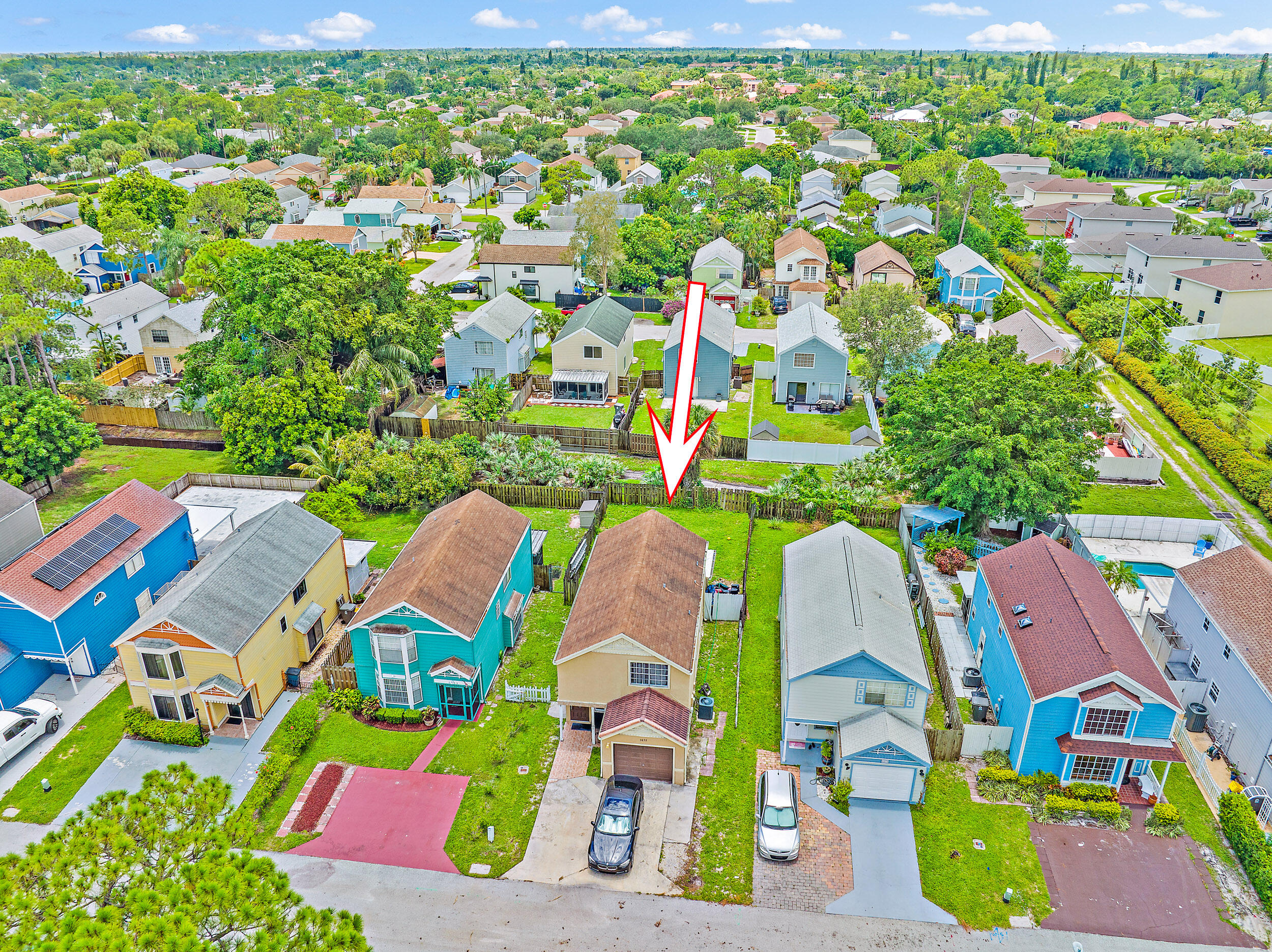 5872 Rambler Rose Way West Palm Beach, FL 33415 - Photo 26 of 30 an aerial view of multiple houses with yard
