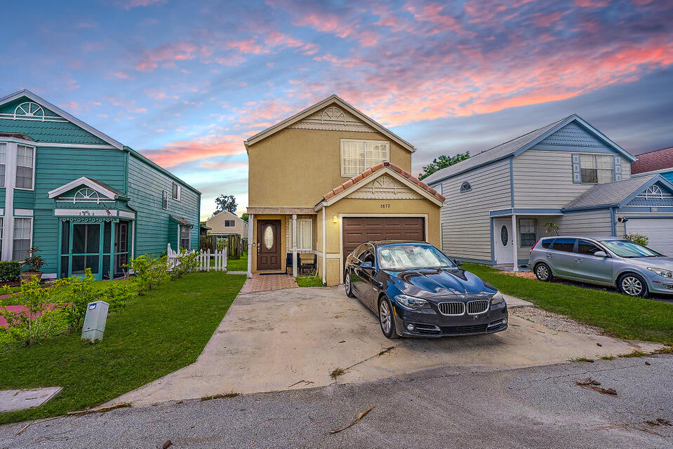 5872 Rambler Rose Way West Palm Beach, FL 33415 - Photo 4 of 30 a car parked in front of a house