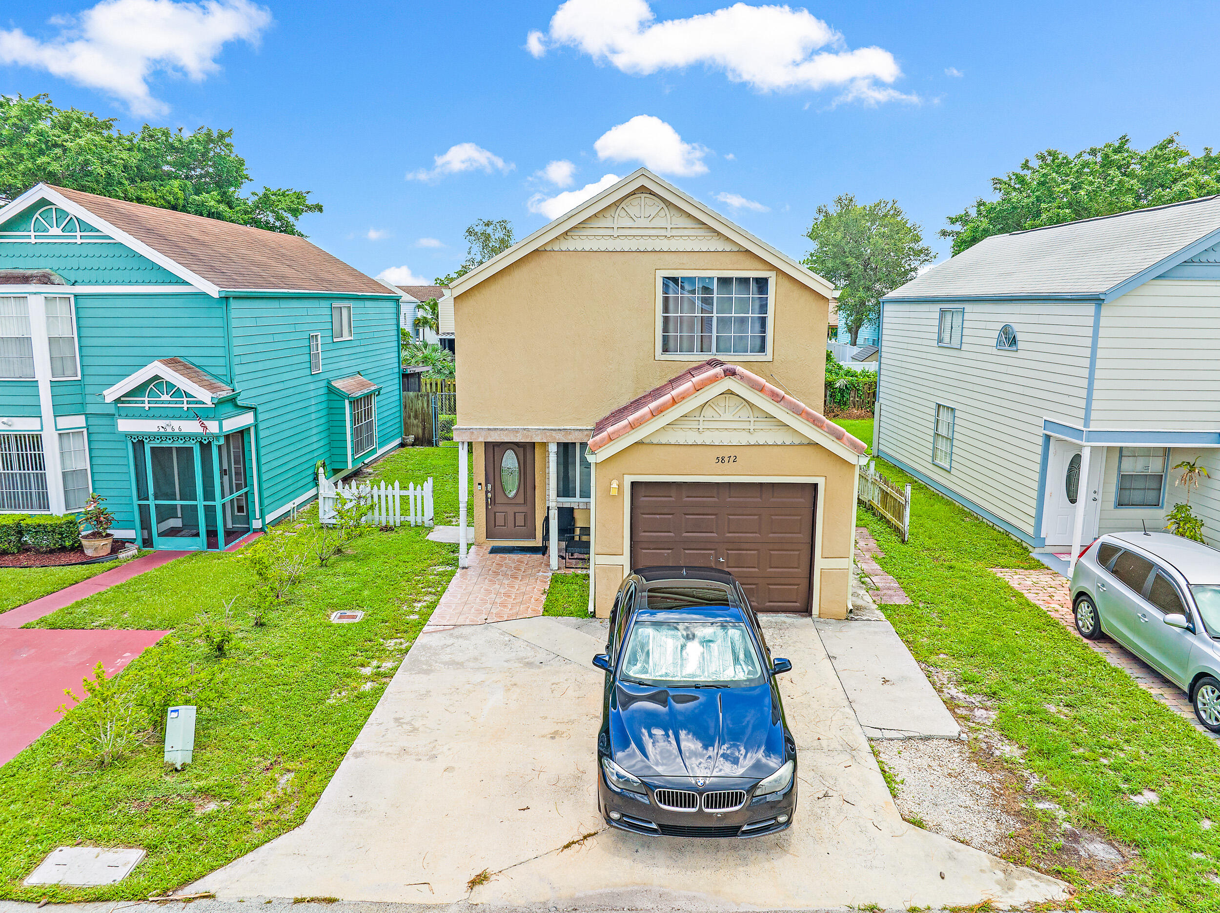 5872 Rambler Rose Way West Palm Beach, FL 33415 - Photo 5 of 30 a front view of a house with a yard and porch