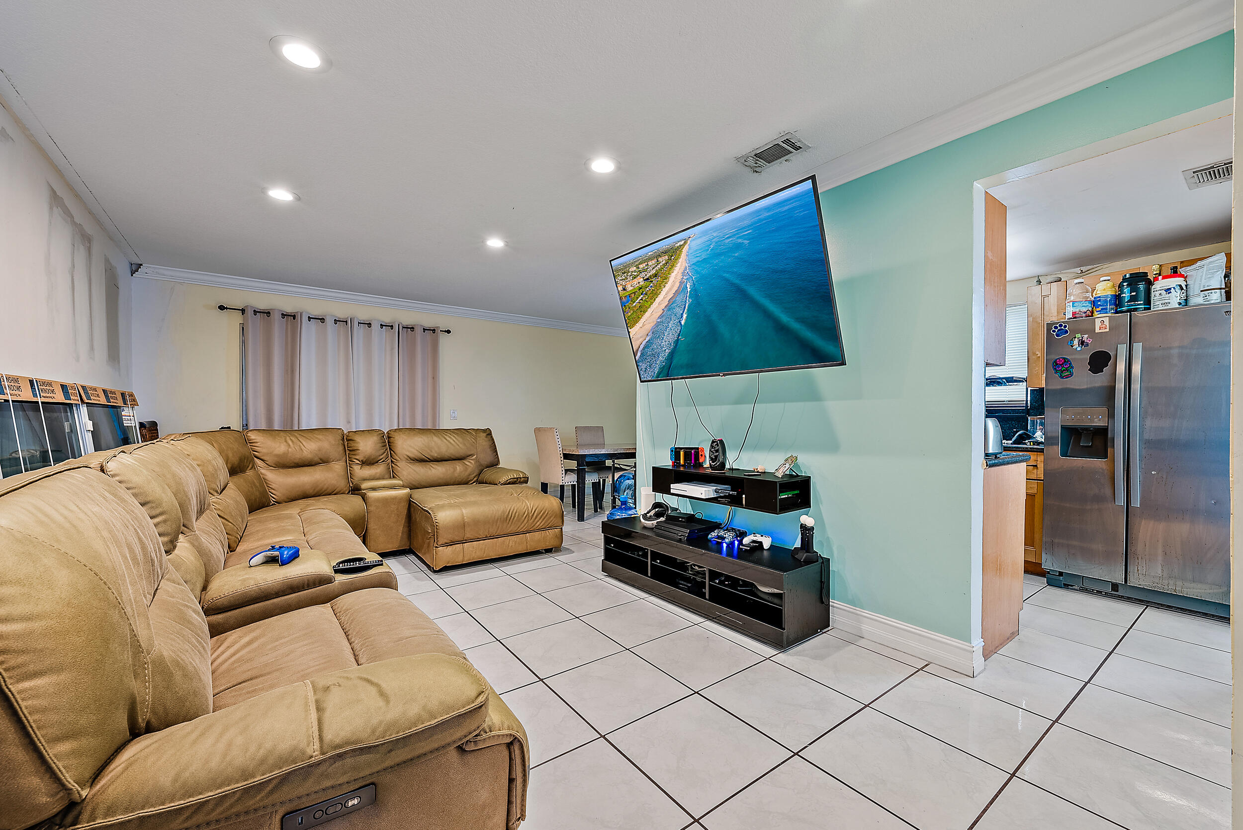 5872 Rambler Rose Way West Palm Beach, FL 33415 - Photo 7 of 30 a living room with furniture and a kitchen area