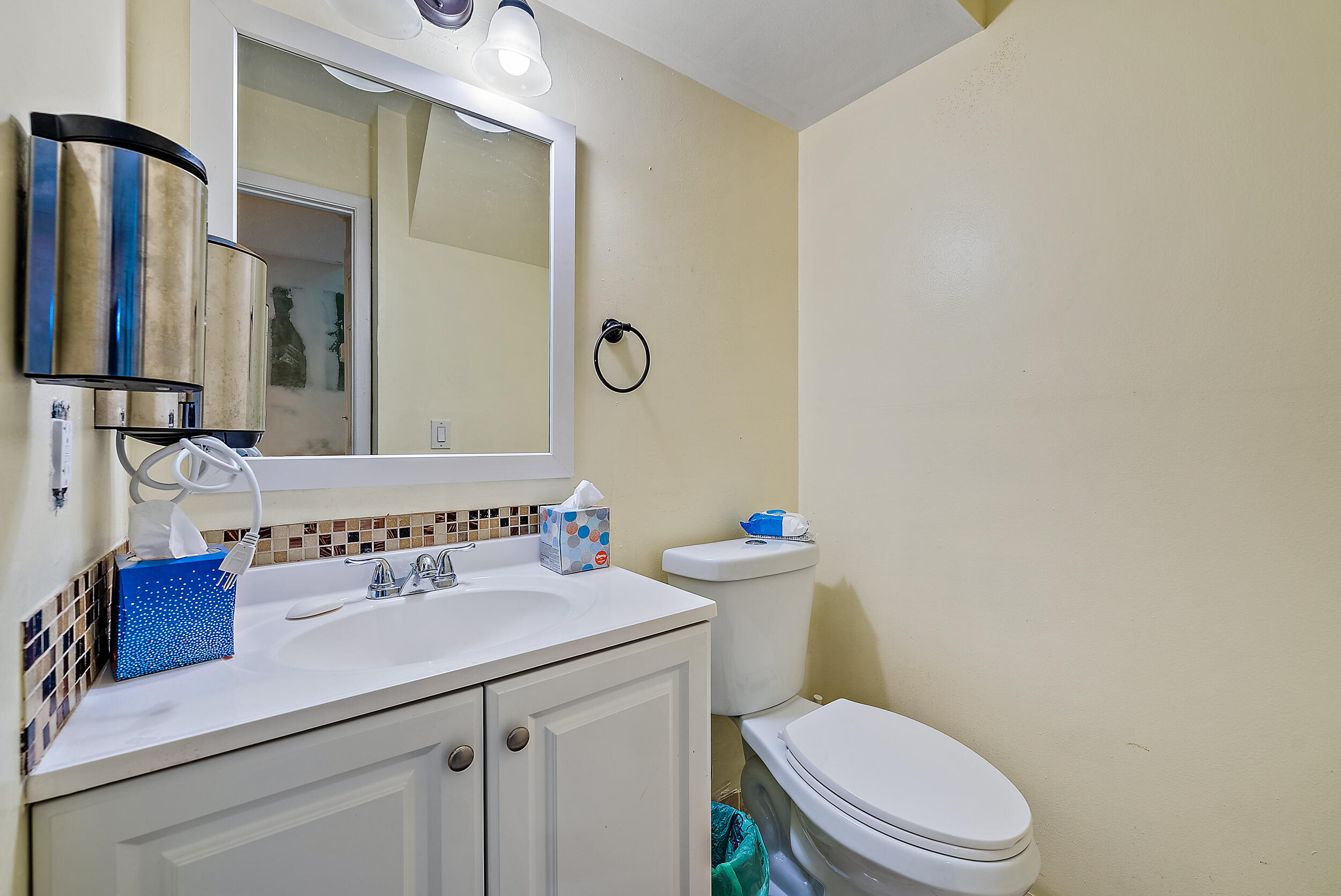 5872 Rambler Rose Way West Palm Beach, FL 33415 - Photo 9 of 30 a bathroom with a sink a toilet and a mirror