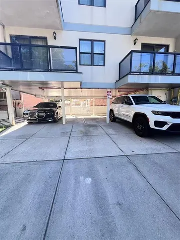 a view of parking garage with cars