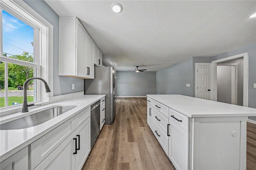 411 Hardy Avenue Southwest Rome, GA 30161 - Photo 12 of 27 a kitchen that has a sink and a stove