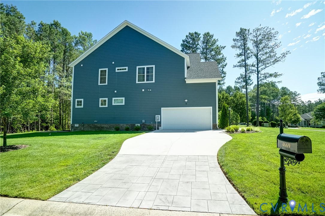 4669 Woburn Road Providence Forge, VA 23140 - Photo 62 of 78 a front view of a house with a yard