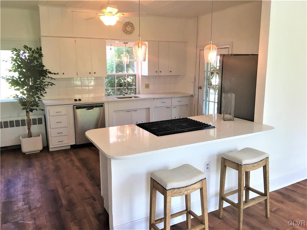 3070 Springtown Road Coopersburg, PA 18036 - Photo 3 of 31 a kitchen with a table chairs sink and cabinets