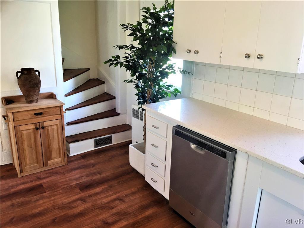 3070 Springtown Road Coopersburg, PA 18036 - Photo 6 of 31 a kitchen with white cabinets and wooden floor