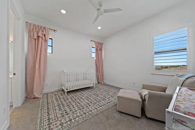 a room with a bed and a chair in it