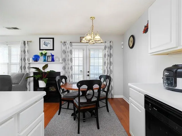 a view of a dining room with furniture and window