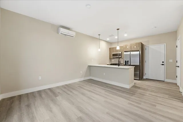 a hallway with wooden floor