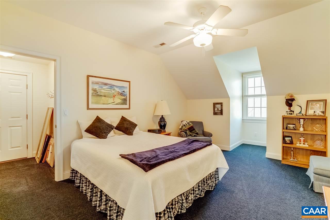 3159 Darby Road Keswick, VA 22947 - Photo 33 of 50 a bedroom with bed and wooden floor