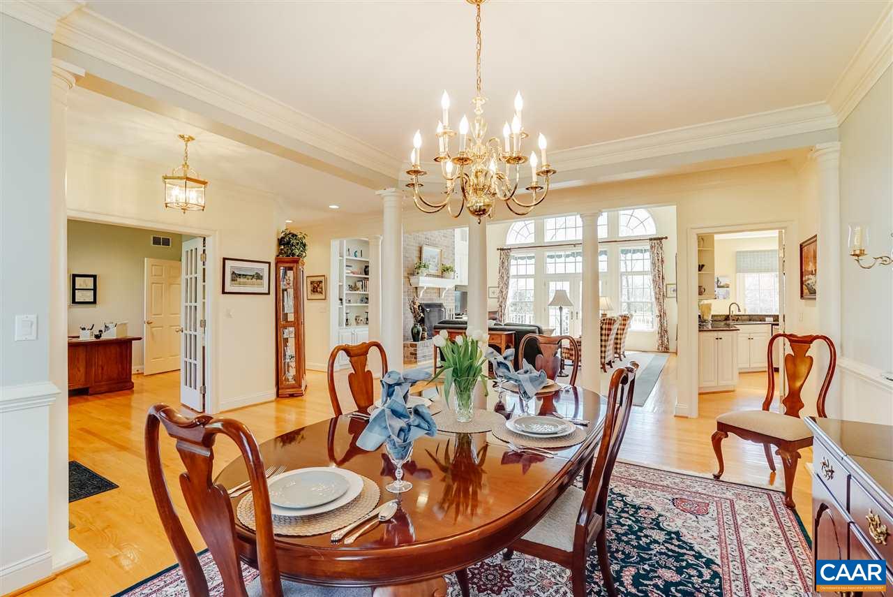 3159 Darby Road Keswick, VA 22947 - Photo 7 of 50 a view of a dining room with furniture wooden floor and chandelier