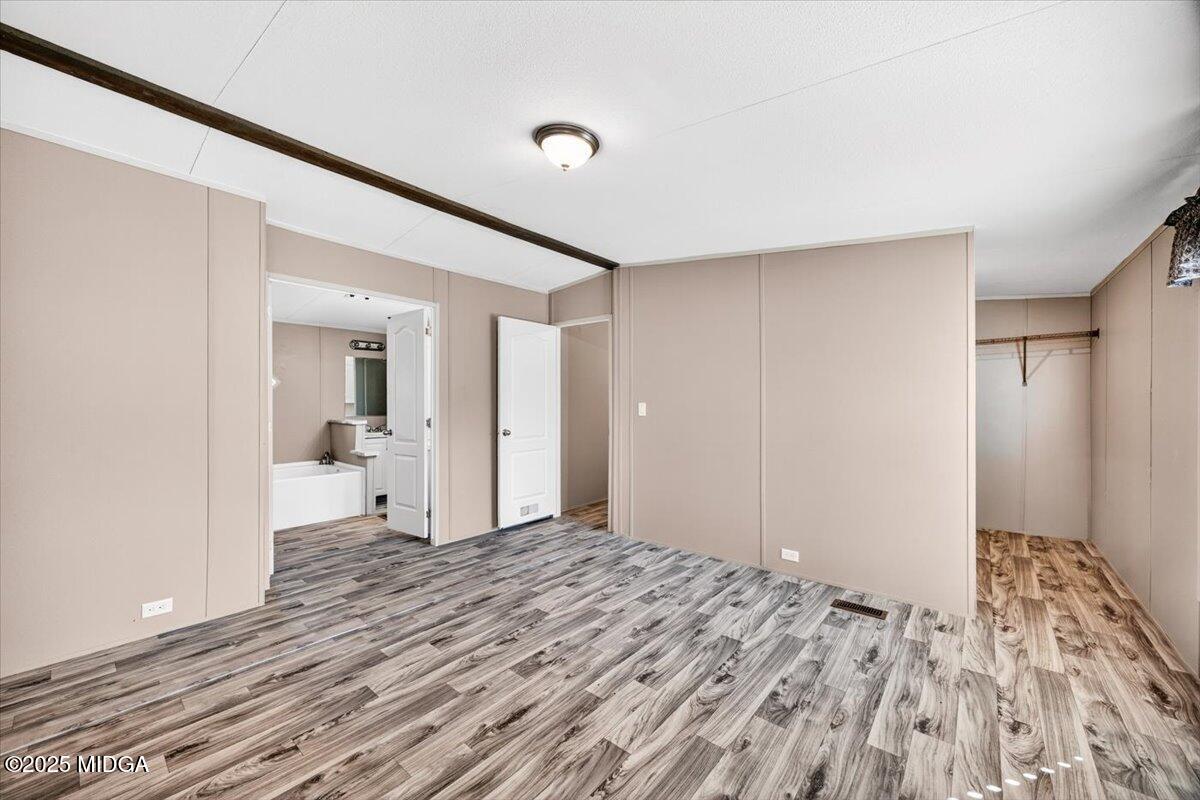 167 Mountain Springs Church Road Macon, GA 31217 - Photo 13 of 32 a bedroom with a bed and a view of bathroom