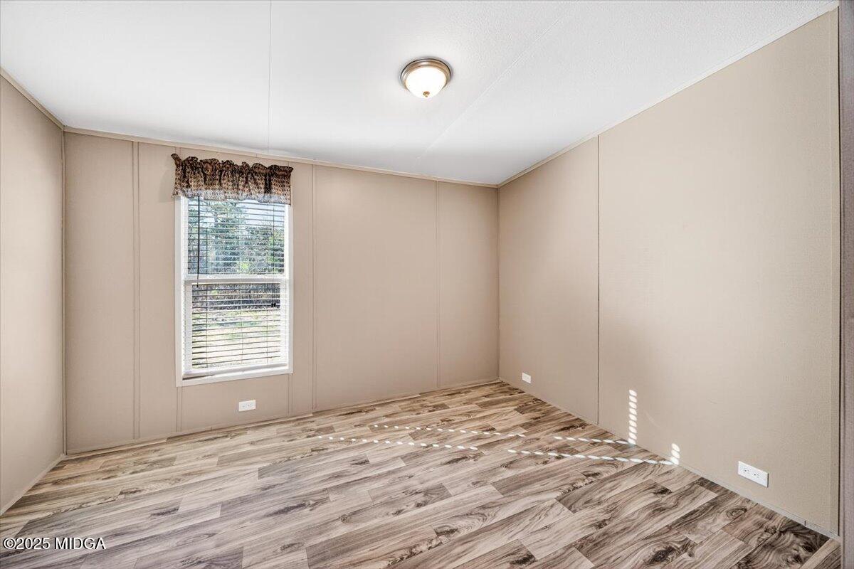 167 Mountain Springs Church Road Macon, GA 31217 - Photo 17 of 32 a view of a room with a wooden floor and window