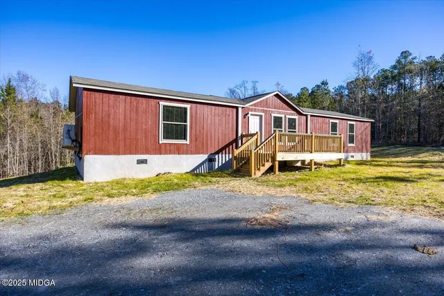 a house with trees in the background