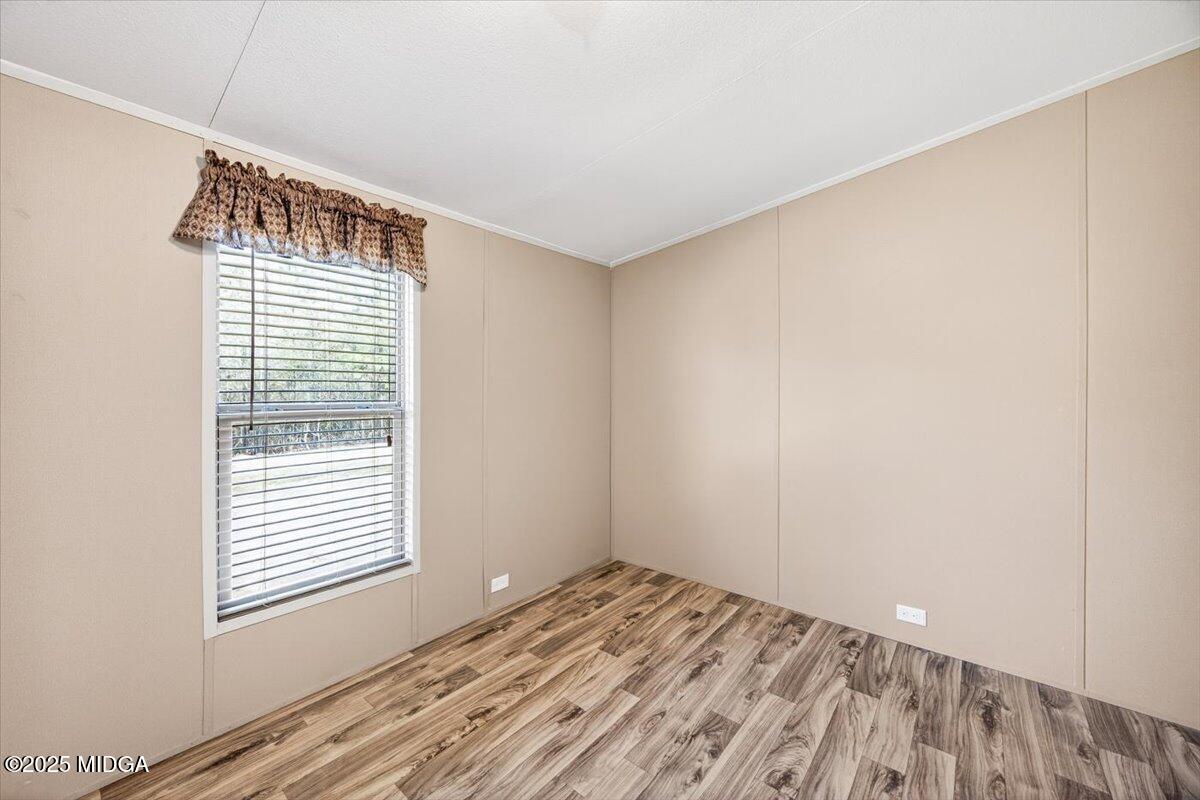167 Mountain Springs Church Road Macon, GA 31217 - Photo 22 of 32 a view of a room with wooden floor and windows