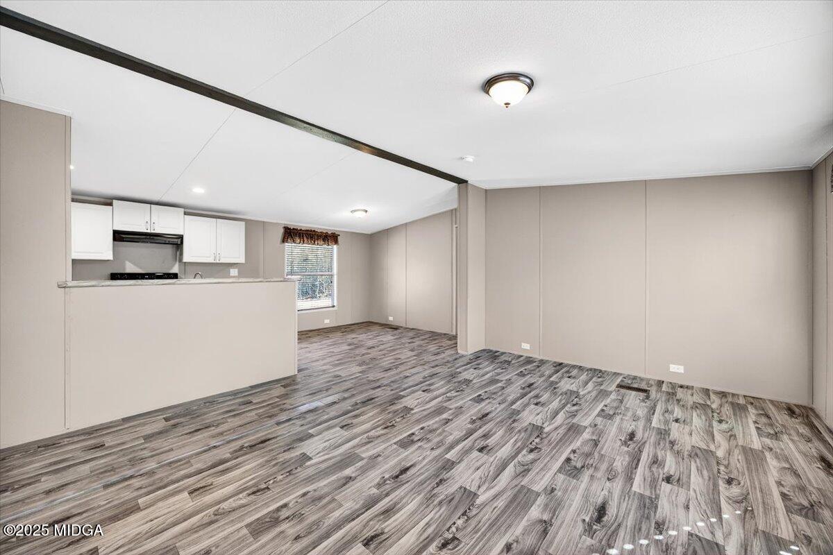 167 Mountain Springs Church Road Macon, GA 31217 - Photo 4 of 32 a view of empty room with wooden floor