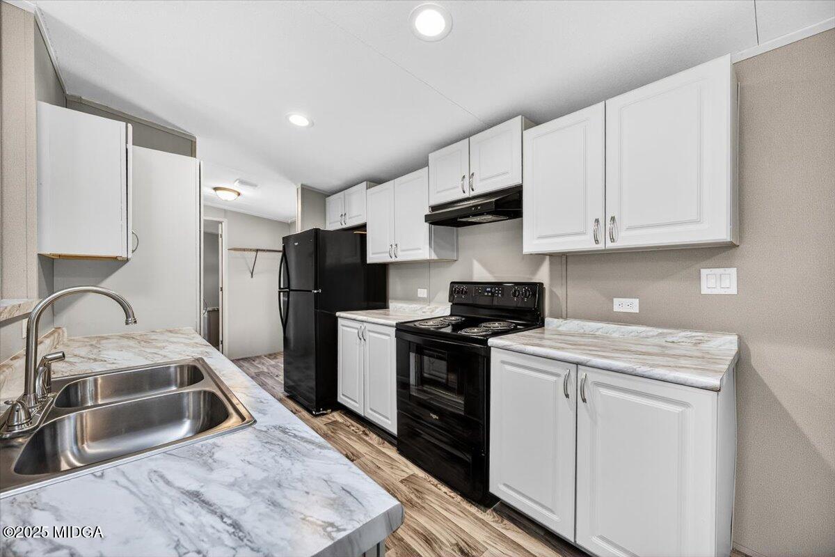 167 Mountain Springs Church Road Macon, GA 31217 - Photo 8 of 32 a kitchen with stainless steel appliances granite countertop a sink stove refrigerator and cabinets
