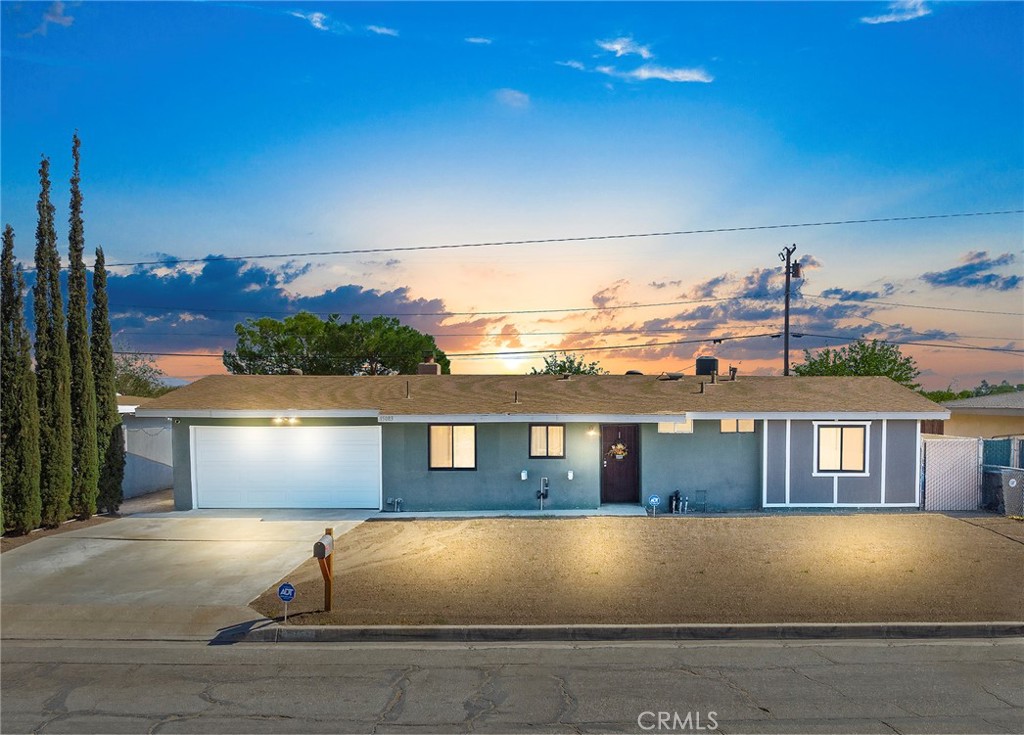 15083 Condor Road Victorville, CA 92394 - Photo 1 of 1 a front view of a house with a yard