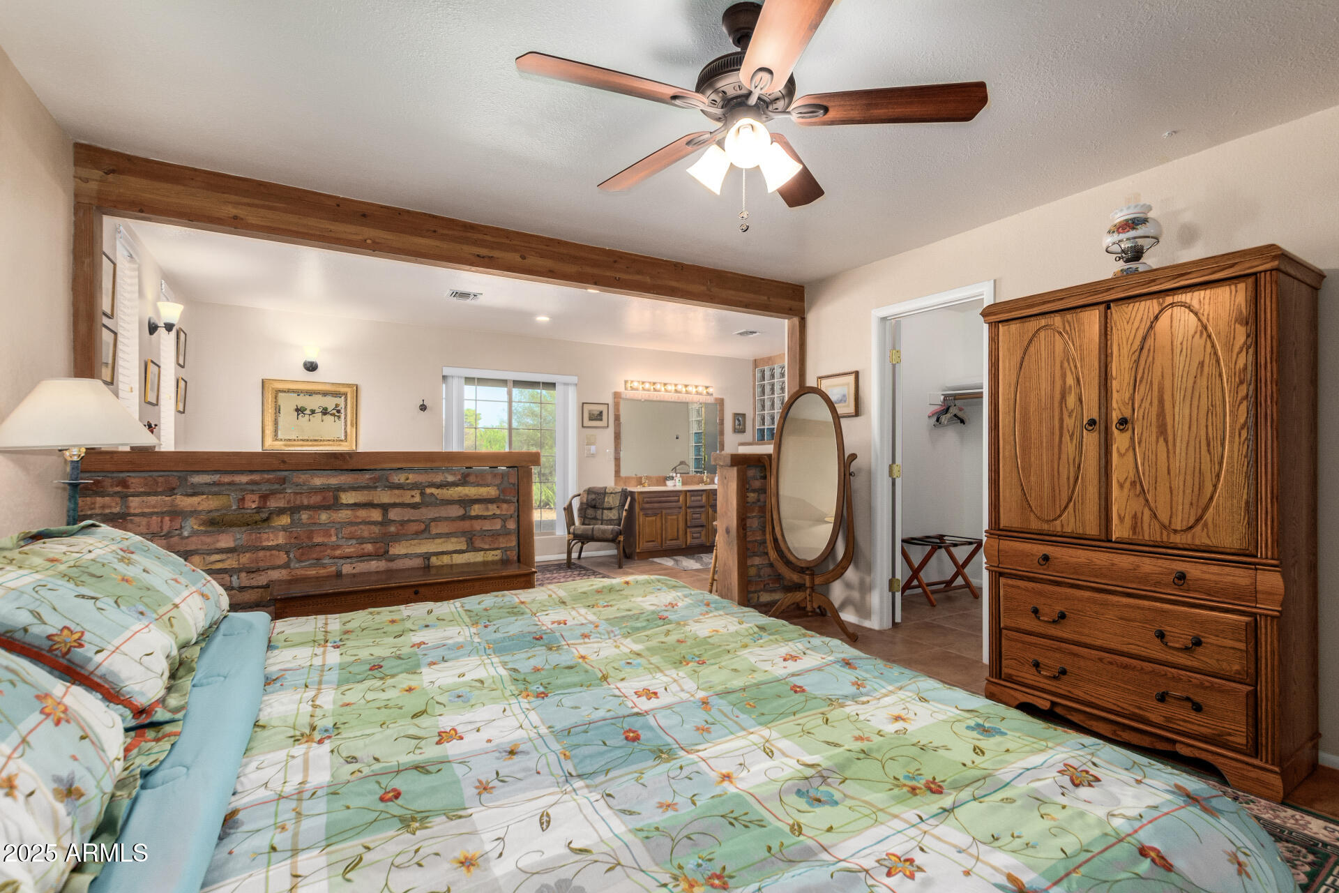 6419 East Cactus Road Scottsdale, AZ 85254 - Photo 14 of 38 a large bedroom with furniture and a mirror