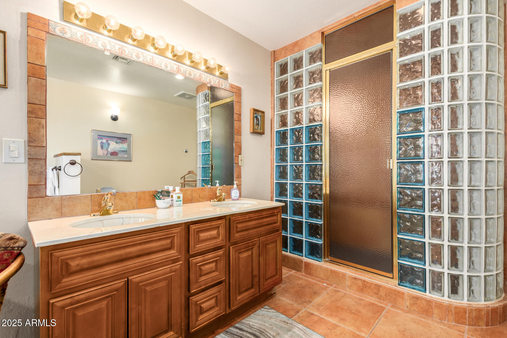 6419 East Cactus Road Scottsdale, AZ 85254 - Photo 18 of 38 a bathroom with a double vanity sink mirror and