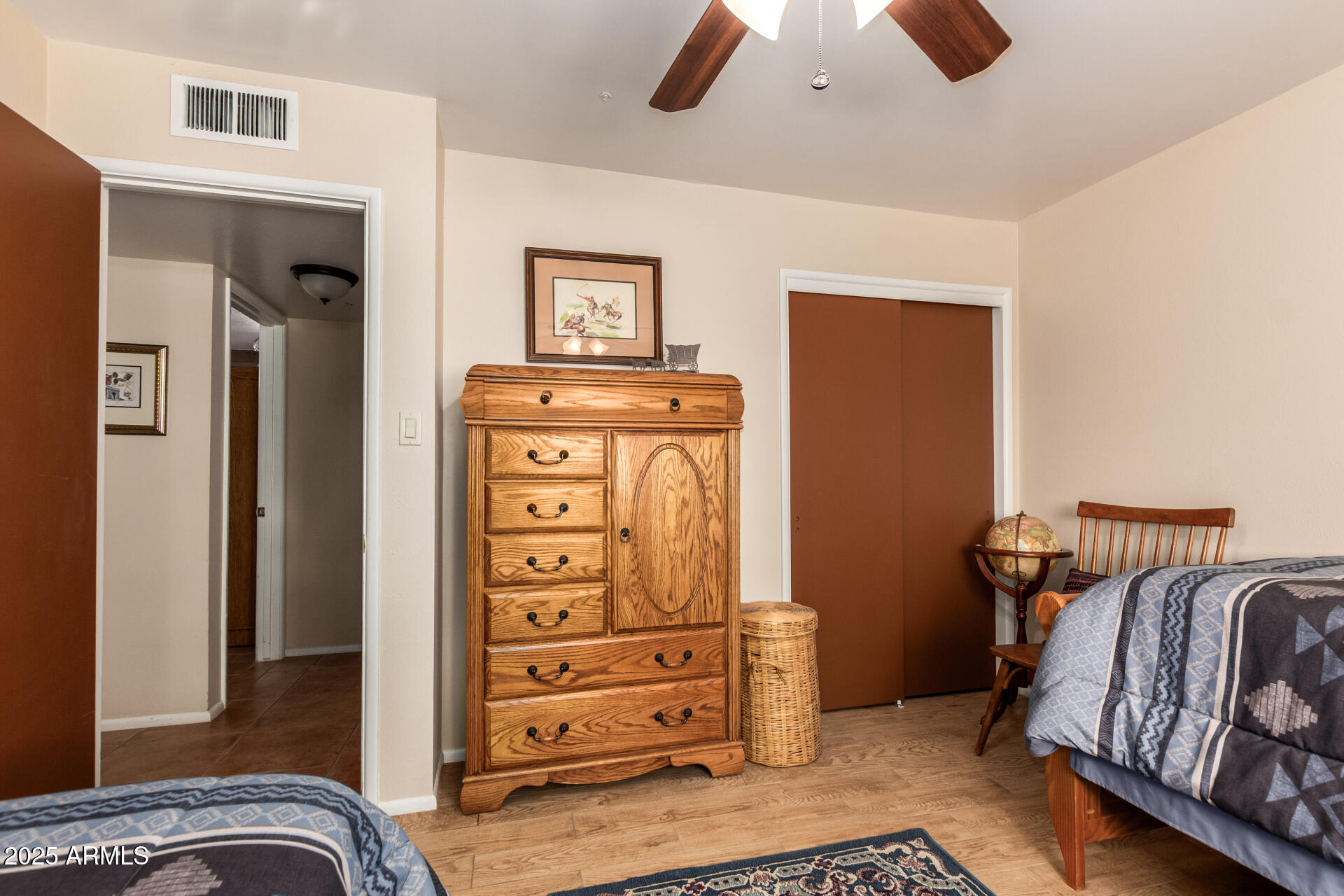 6419 East Cactus Road Scottsdale, AZ 85254 - Photo 23 of 38 a view of bedroom with furniture and closet