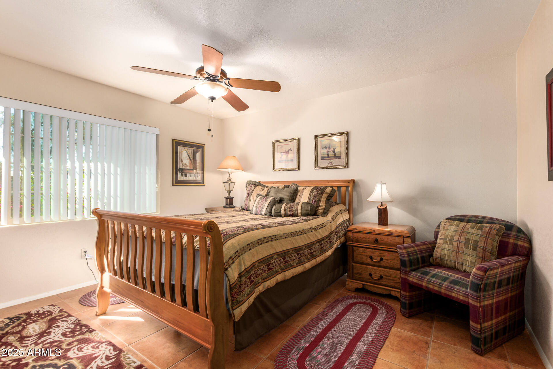 6419 East Cactus Road Scottsdale, AZ 85254 - Photo 25 of 38 a bed room with a bed and a couch