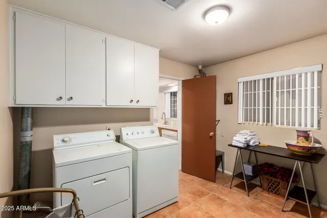a view of a storage & utility room with a window