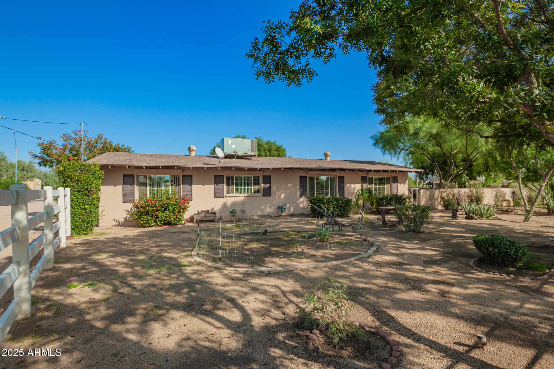 6419 East Cactus Road Scottsdale, AZ 85254 - Photo 29 of 38 a front view of a house with a garden