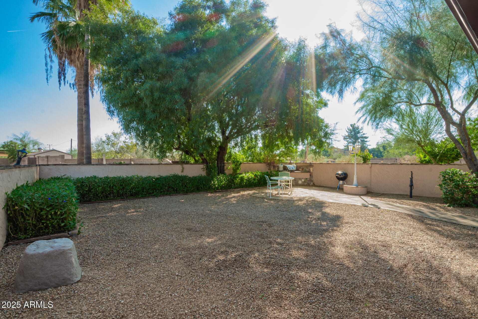 6419 East Cactus Road Scottsdale, AZ 85254 - Photo 33 of 38 a backyard of a house with lots of green space