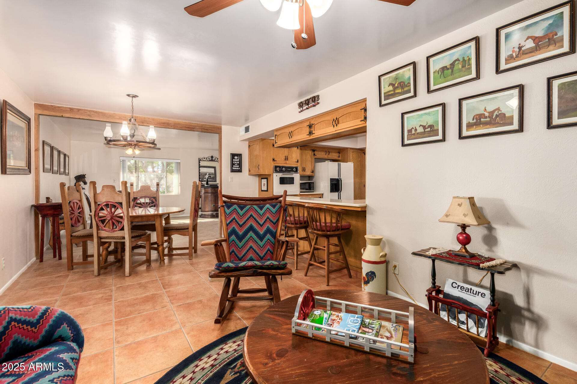 6419 East Cactus Road Scottsdale, AZ 85254 - Photo 5 of 38 a room with lots of furniture and view of kitchen