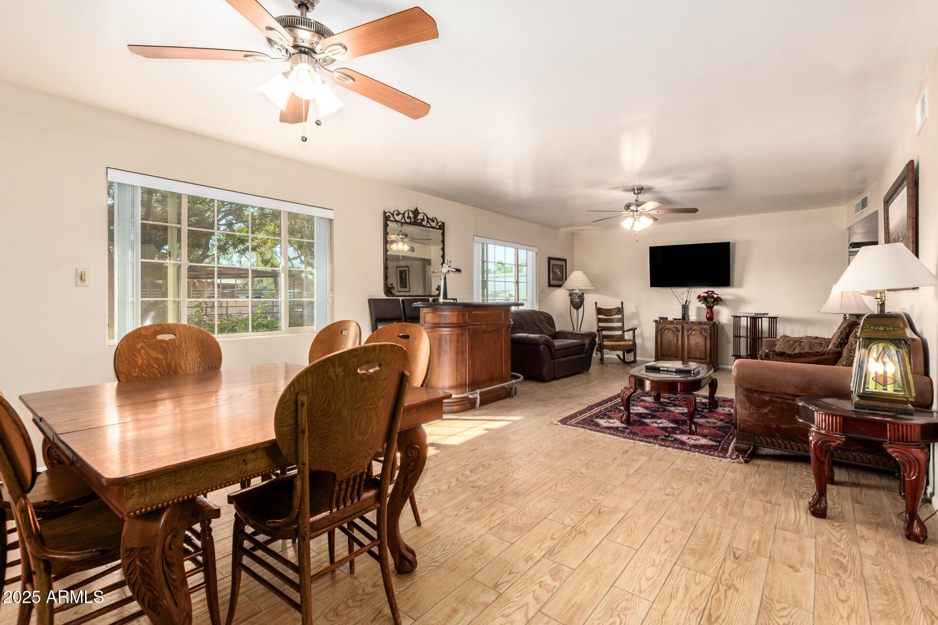 6419 East Cactus Road Scottsdale, AZ 85254 - Photo 7 of 38 a living room with furniture and a flat screen tv