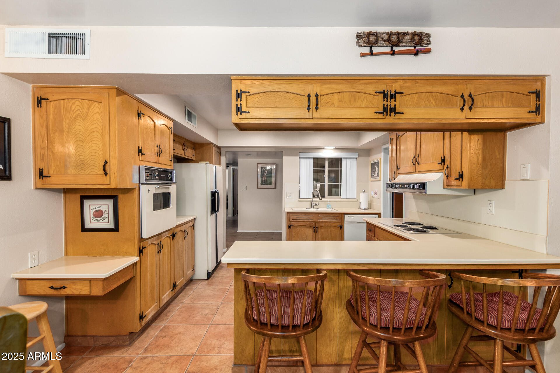 6419 East Cactus Road Scottsdale, AZ 85254 - Photo 9 of 38 a view of a kitchen with furniture and a window