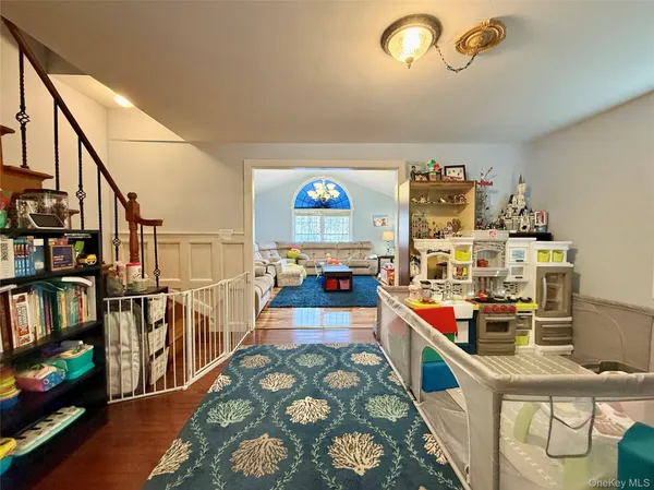a living room with lots of furniture and a wooden floor