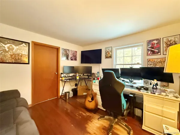 a room with furniture and a flat screen tv