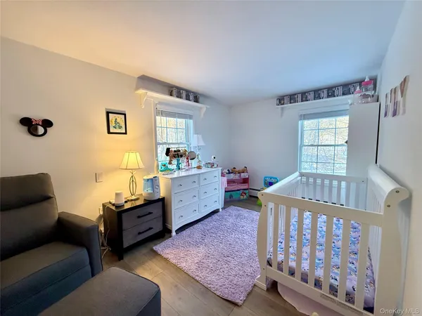 a bedroom with furniture and a window