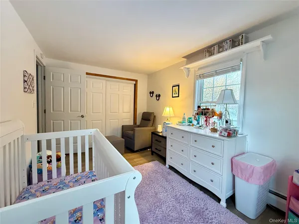 a bedroom with furniture and a window