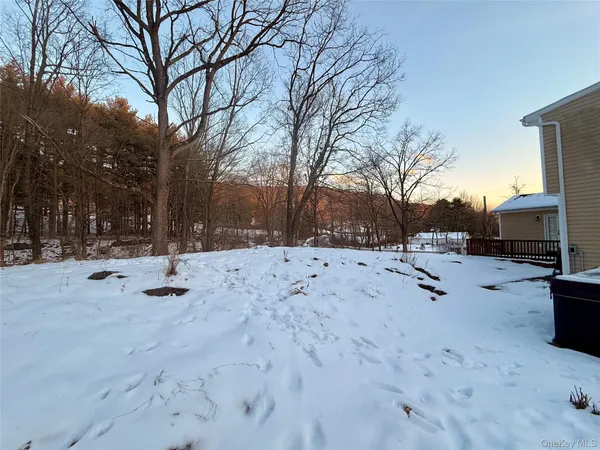 a view of a backyard with sitting area