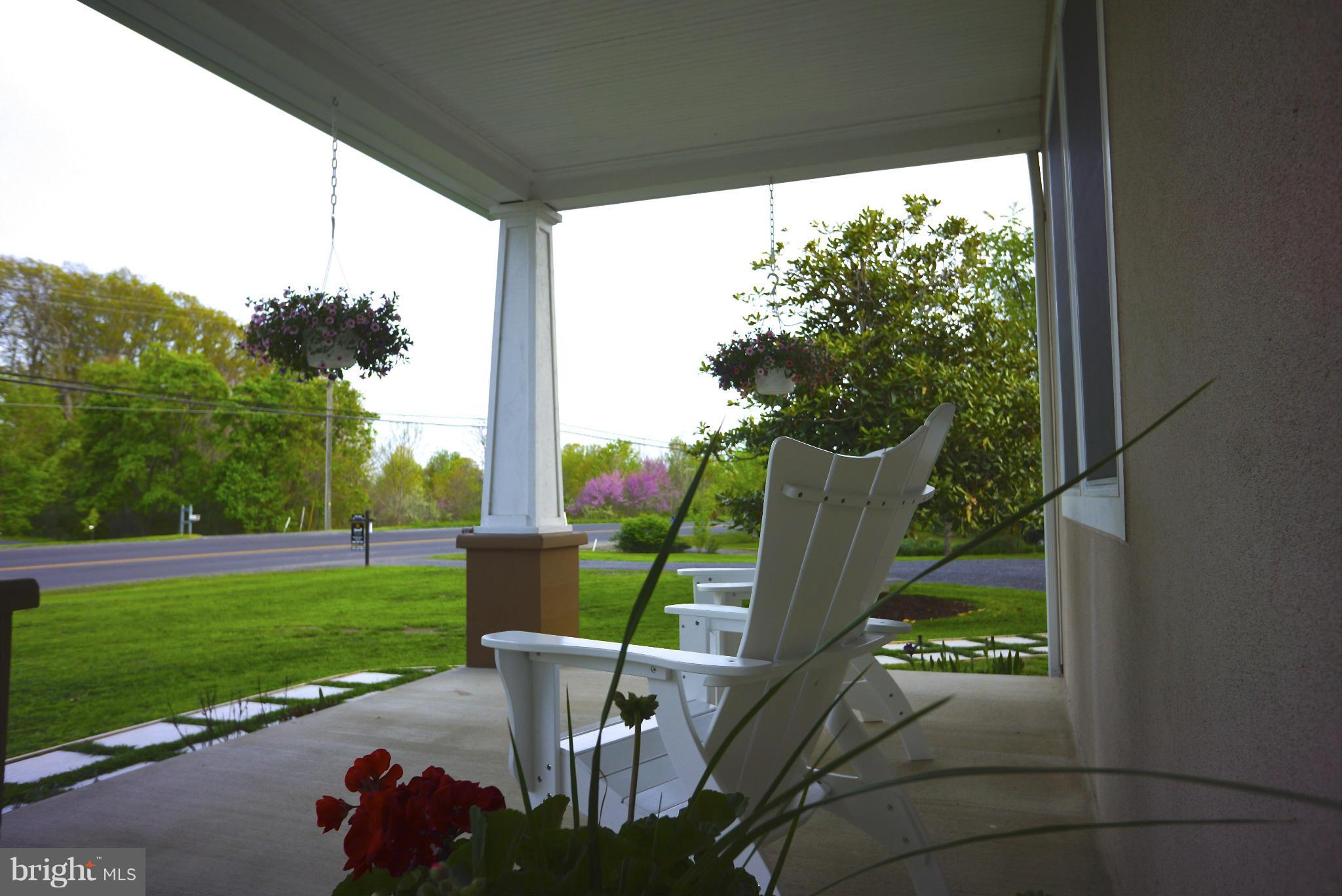 4048 Rectortown Road Marshall, VA 20115 - Photo 2 of 30 a view of a two chair in the patio next to a yard