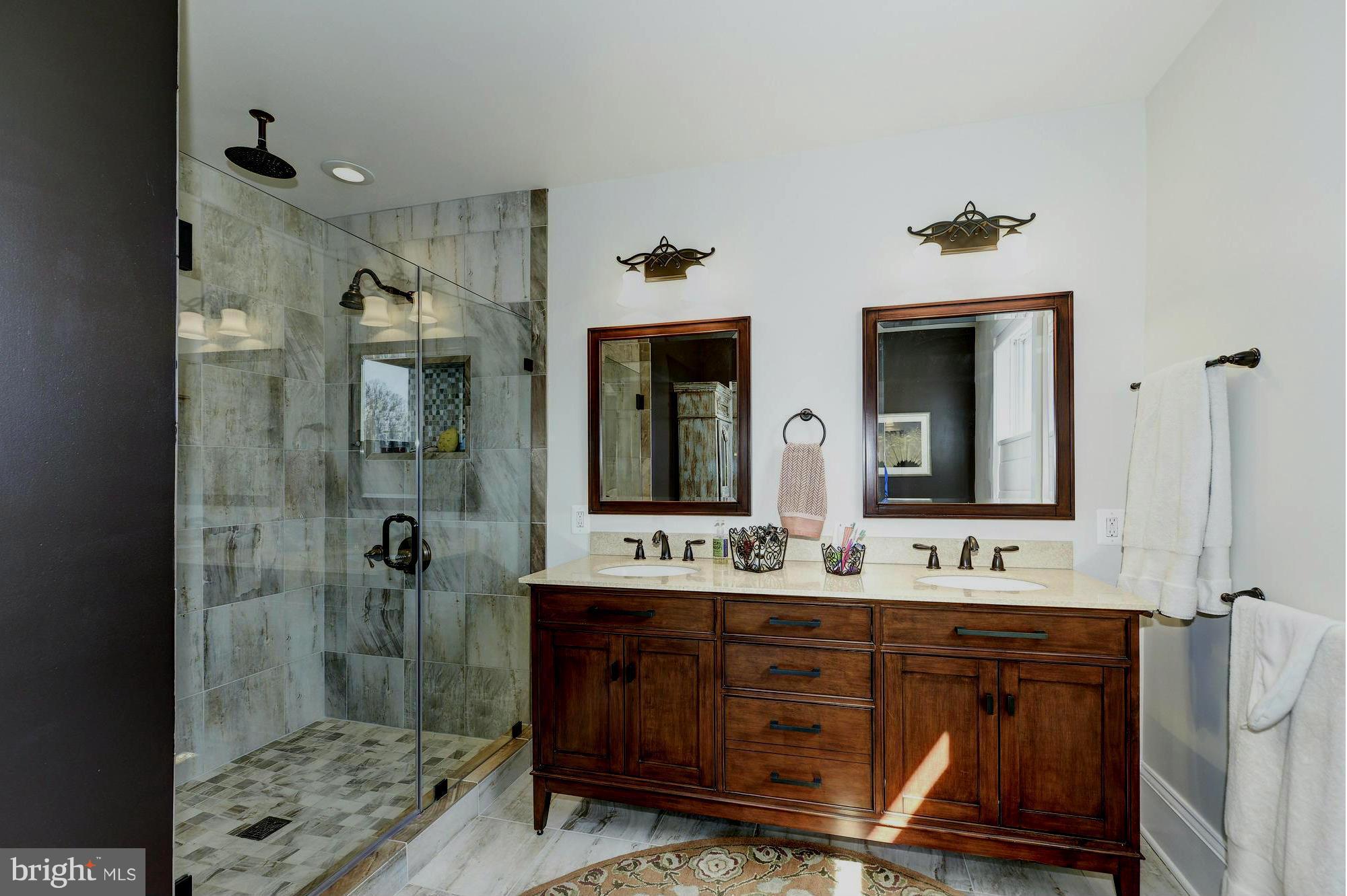 4048 Rectortown Road Marshall, VA 20115 - Photo 21 of 30 a bathroom with a sink mirror and shower