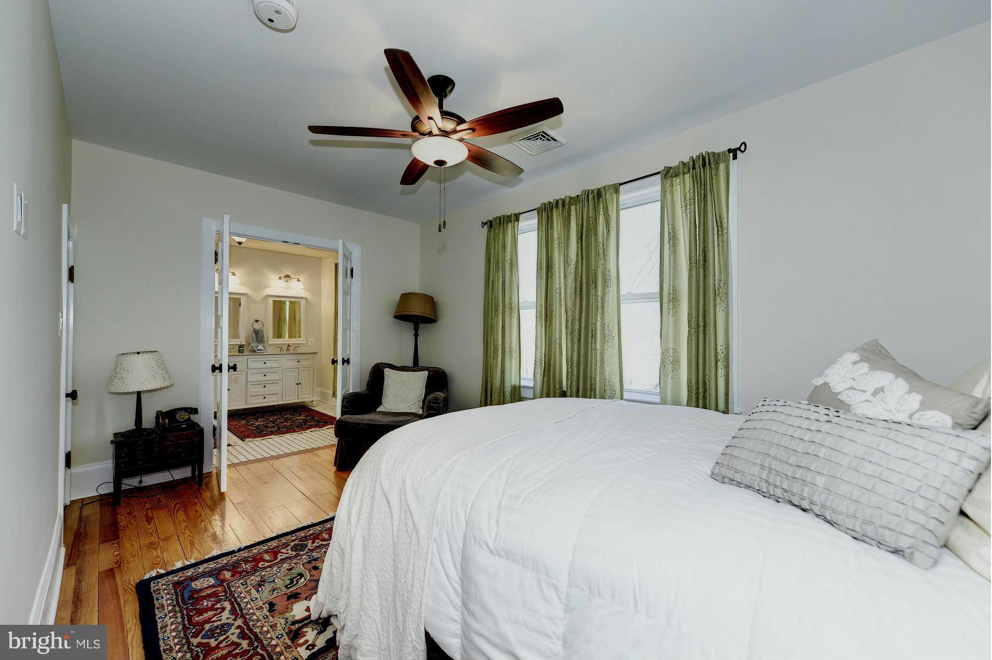 4048 Rectortown Road Marshall, VA 20115 - Photo 22 of 30 a bedroom with a bed a window and a chandelier
