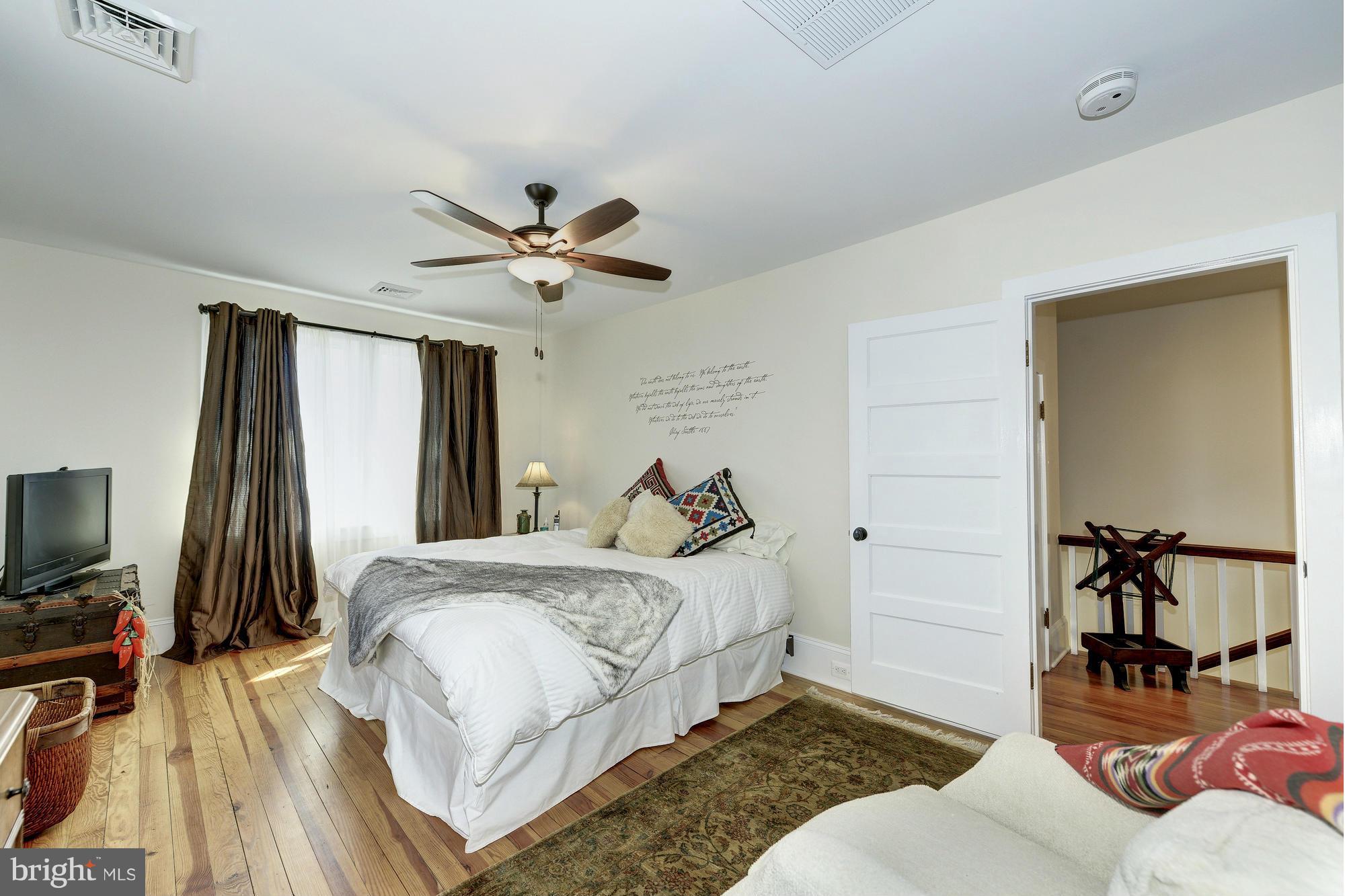 4048 Rectortown Road Marshall, VA 20115 - Photo 24 of 30 a bedroom with a bed and a flat screen tv