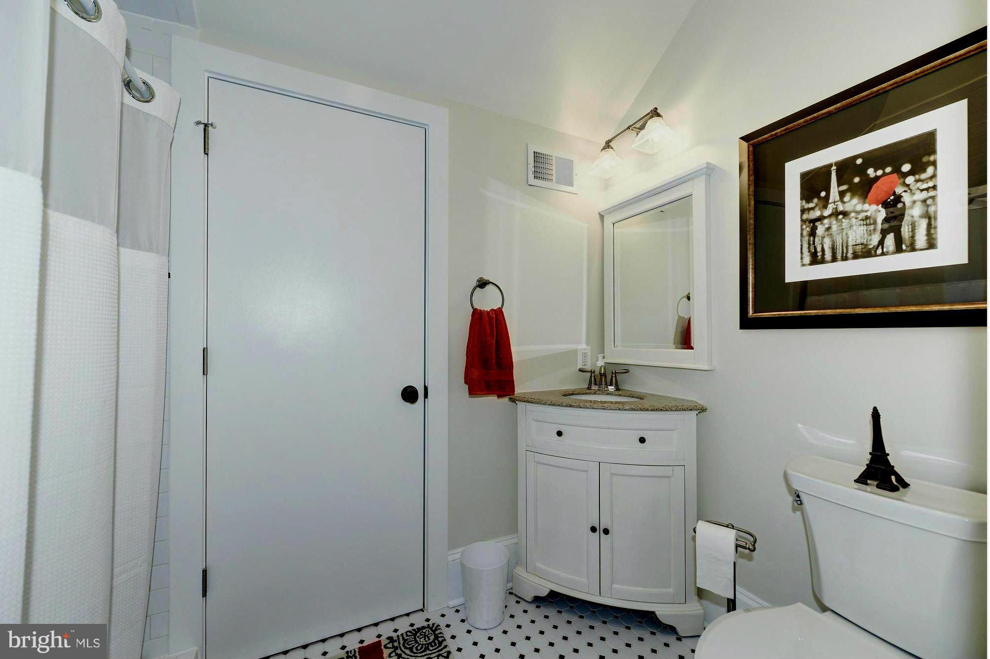 4048 Rectortown Road Marshall, VA 20115 - Photo 28 of 30 a bathroom with a toilet a sink and mirror