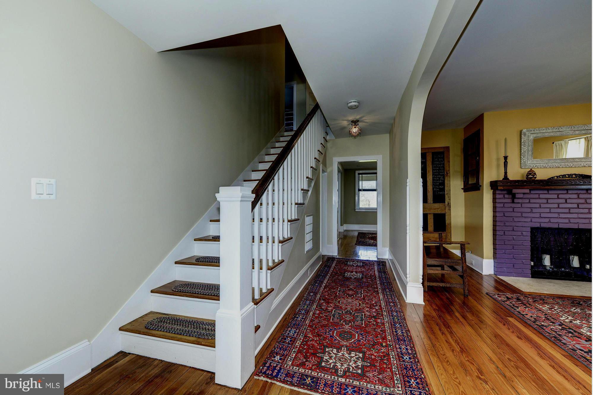4048 Rectortown Road Marshall, VA 20115 - Photo 9 of 30 a view of an entryway with wooden floor a fireplace and a rug