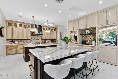 a kitchen with stainless steel appliances granite countertop a sink and cabinets
